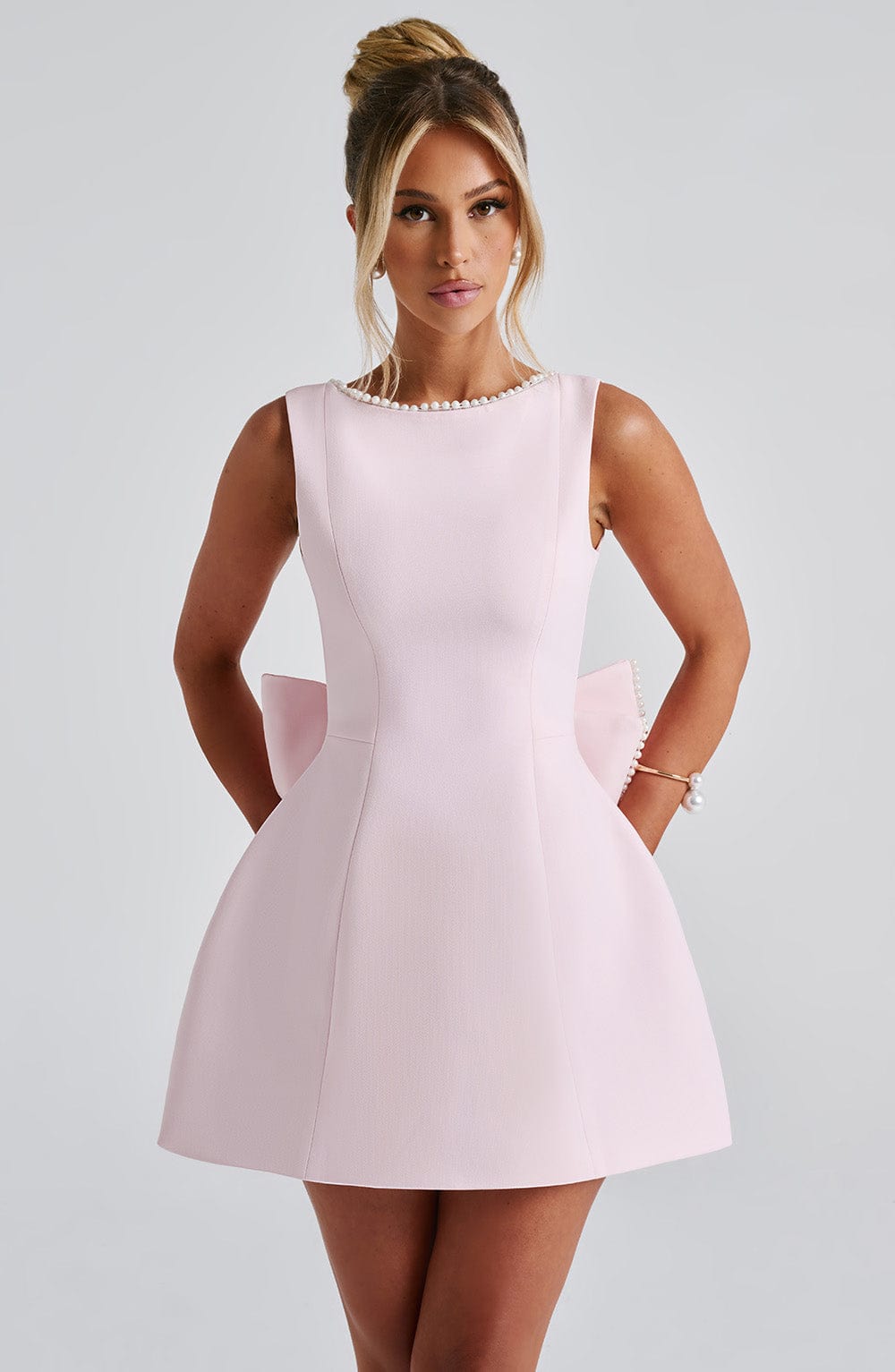 Tanzanix | Structured mini dress with pearl neckline and bow-Apparel & Accessories > Clothing > Dresses-Pink-S-Tanzanix